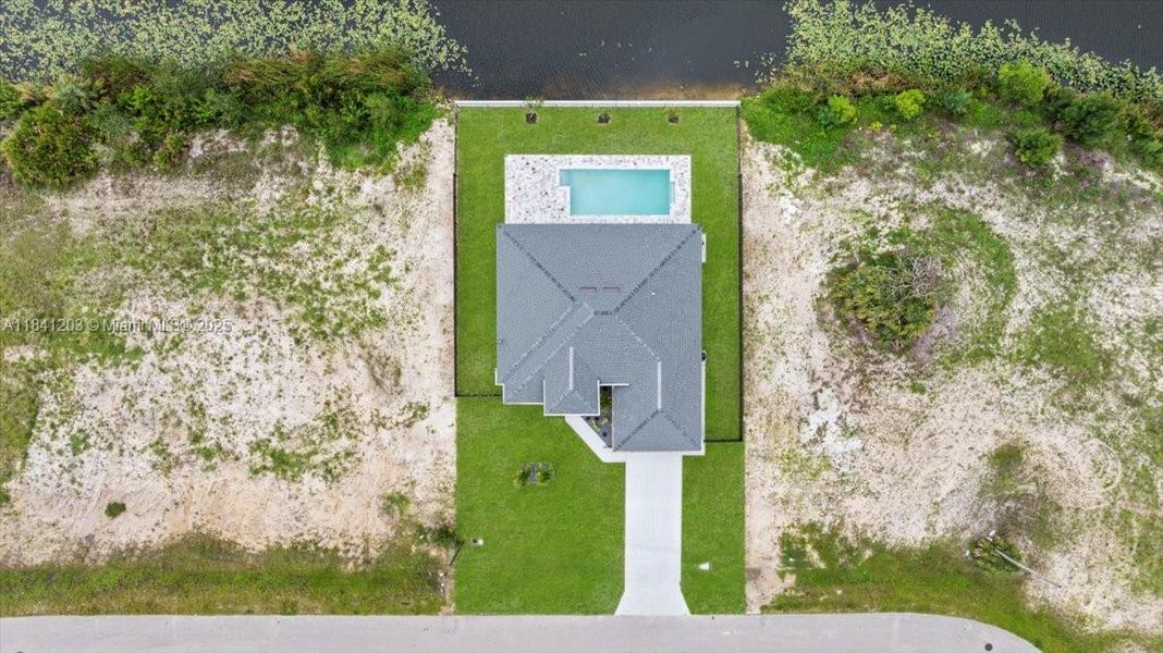 Front exterior of a new home in , Cape Coral, FL, highlighting curb appeal (Image 31). Front exterior of a new home in , Cape Coral, FL, highlighting curb appeal (Image 31).