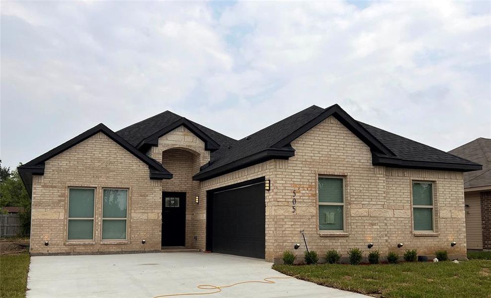 French provincial home with a garage