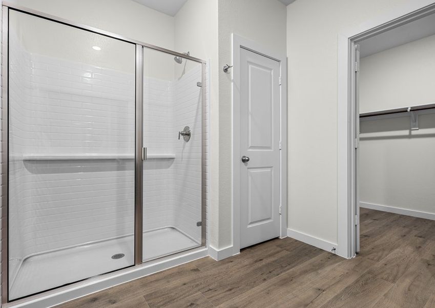The master bathroom has a glass, walk-in shower.