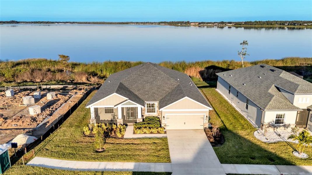 Front exterior of a new home in , Lake Alfred, FL, highlighting curb appeal (Image 1). Front exterior of a new home in , Lake Alfred, FL, highlighting curb appeal (Image 1).