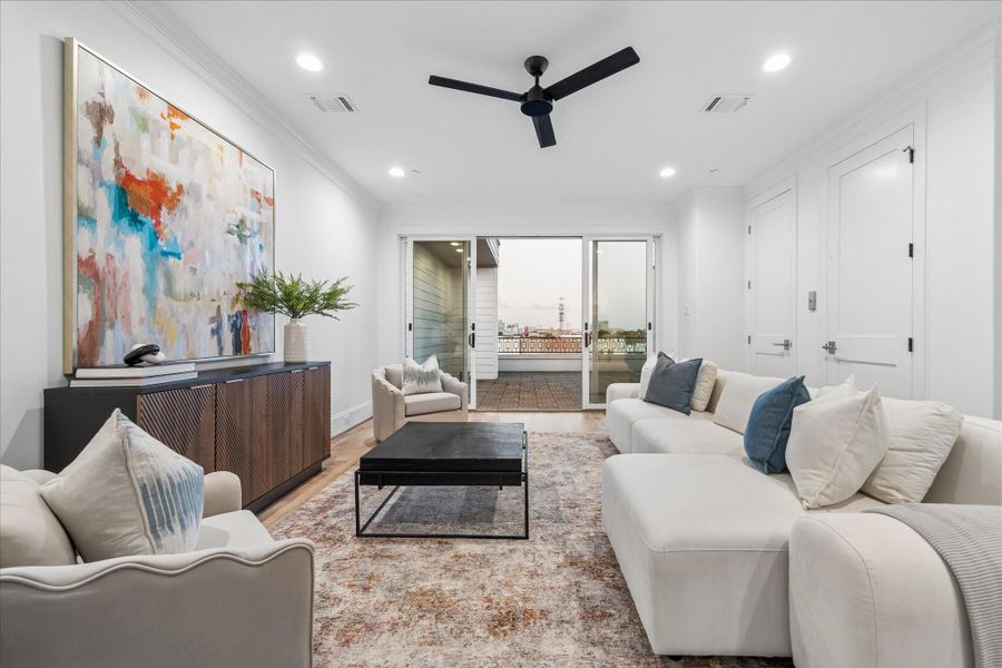 4th floor features a huge game room that opens to a rooftop deck.