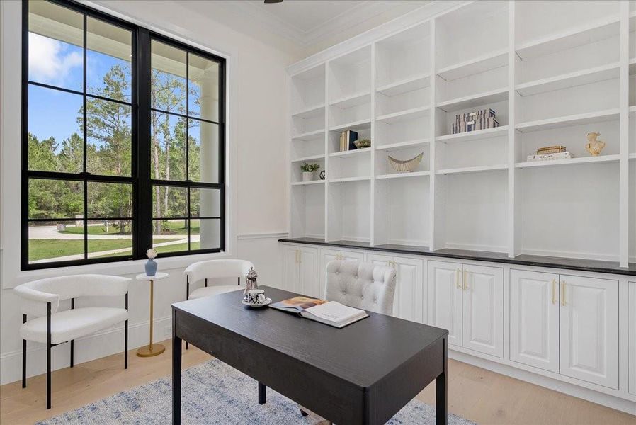 Custom on-site built floor to ceiling cabinetry is present throughout the home.