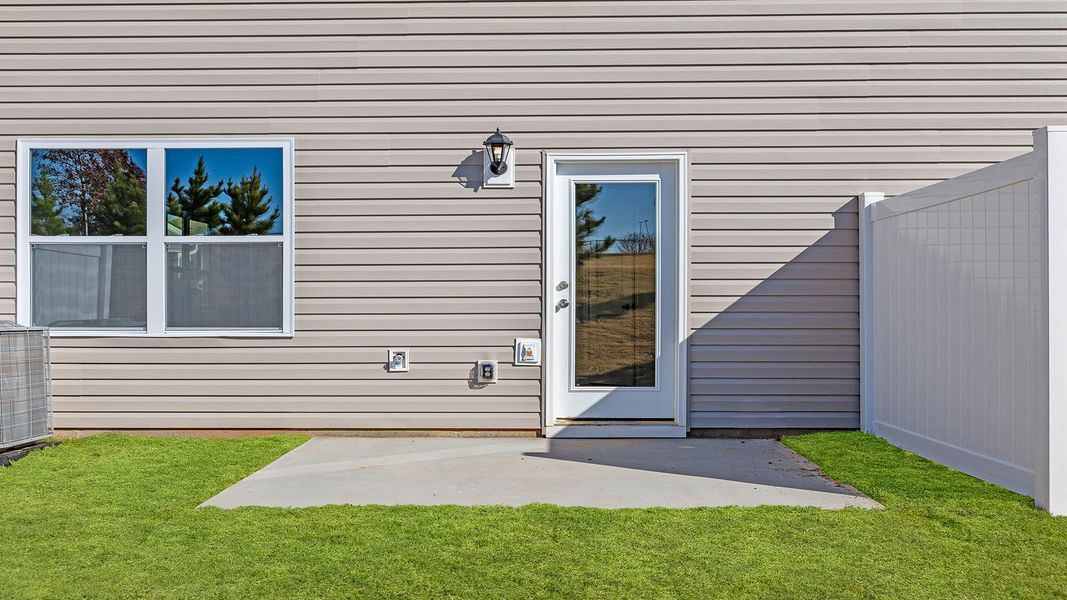 Exterior details and patio area of a home in Brookside Ridge Townhomes, Greer (Image 4).