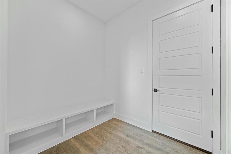 Mudroom with light wood-style floors and baseboards Mudroom with light wood-style floors and baseboards