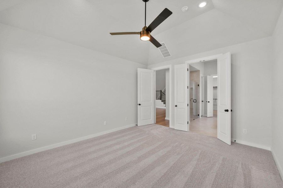 Primary Bedroom with elevated ceiling