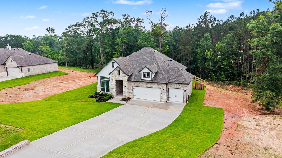 Front exterior of a new home in Rose Hill Estates, Willis, TX, highlighting curb appeal (Image 23).