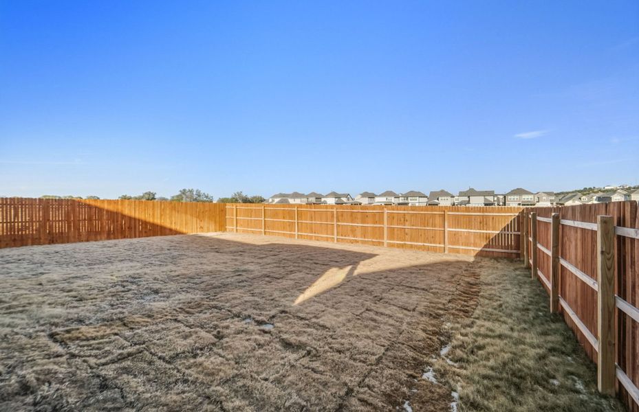 Exterior details and patio area of a home in Saddleback at Santa Rita Ranch, Liberty Hill (Image 26).