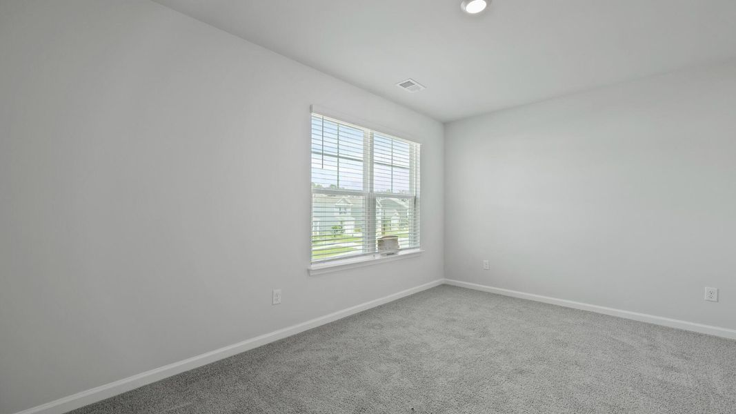 Spacious, unfurnished interior of a new home in Pine Hills at Cane Bay, Summerville (Image 20).