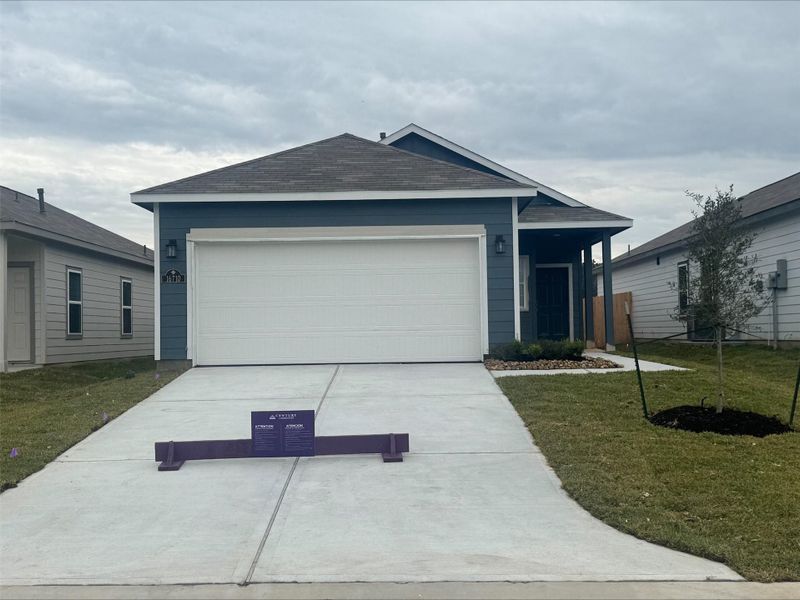 Front exterior of a new home in Maple Heights, Porter, TX, highlighting curb appeal (Image 2).
