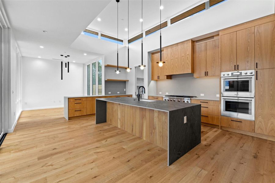 Main kitchen and casual dining plus breakfast bar. Counters and backsplash are Fior Di Bosco marble. Doulble oven plus microwave (not shown).