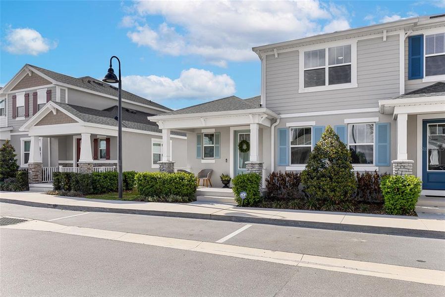 Front exterior of a new home in Hickory Grove, Winter Springs, FL, highlighting curb appeal (Image 25).