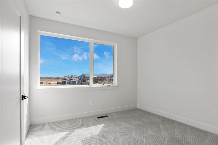 Spacious, unfurnished interior of a new home in West Grange, Longmont (Image 28).