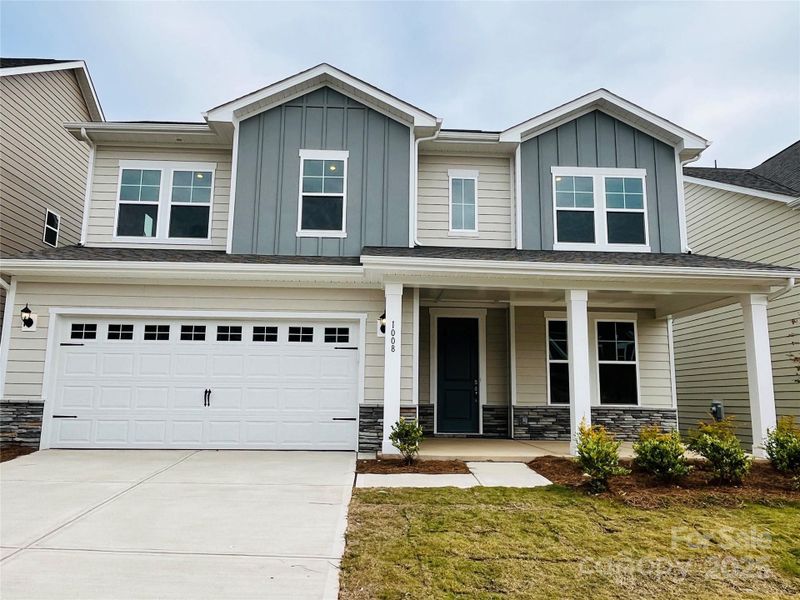 Front exterior of a new home in Moore Farms, Indian Trail, NC, highlighting curb appeal (Image 1).