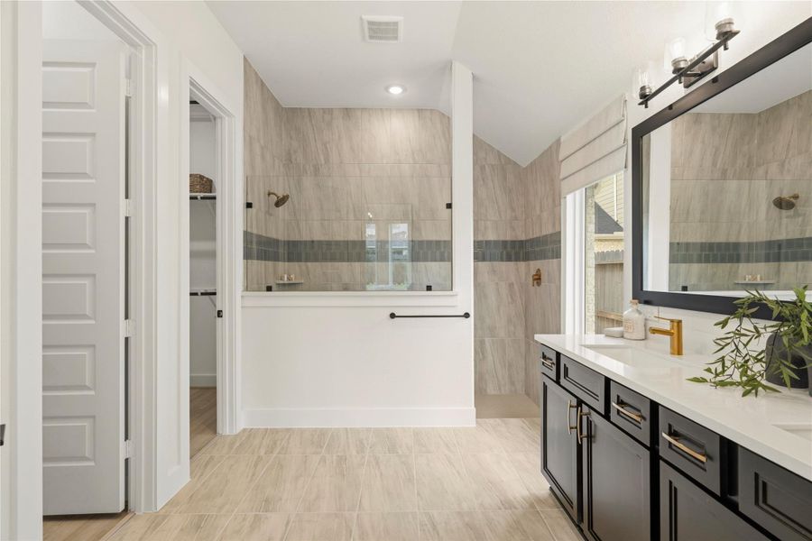 Primary bathroom with spacious shower and walk in closet Primary bathroom with spacious shower and walk in closet