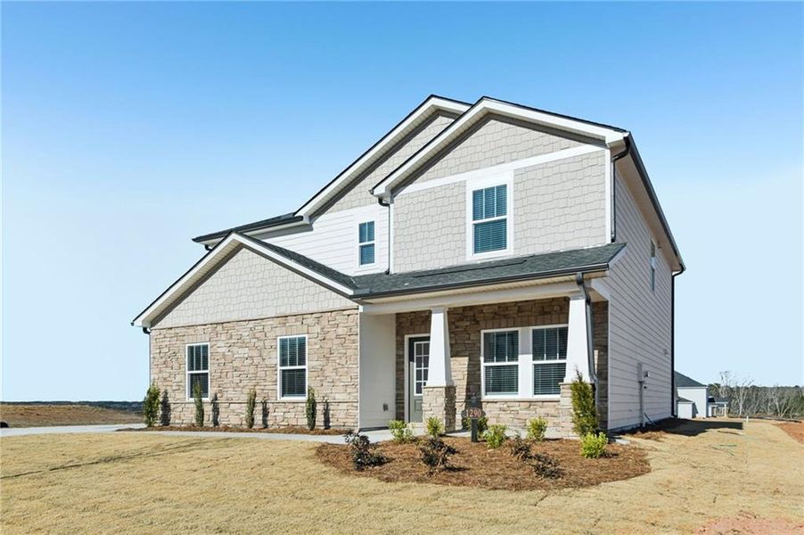 Front exterior of a new home in River Pointe, Monroe, GA, highlighting curb appeal (Image 24).