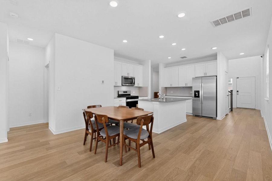 Dining area featuring recessed lighting and light wood finished floors