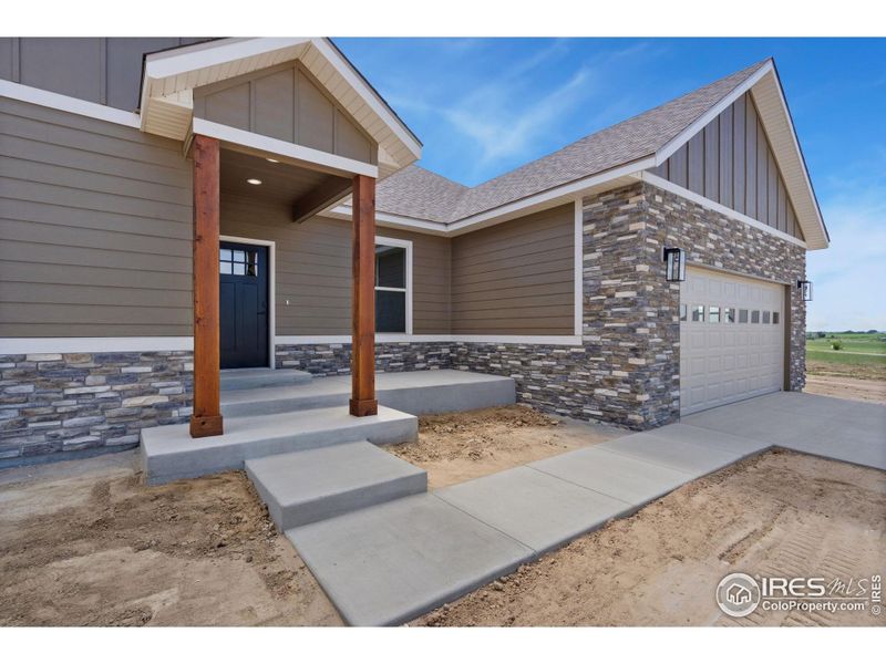 Front exterior of a new home in , Fort Morgan, CO, highlighting curb appeal (Image 15).