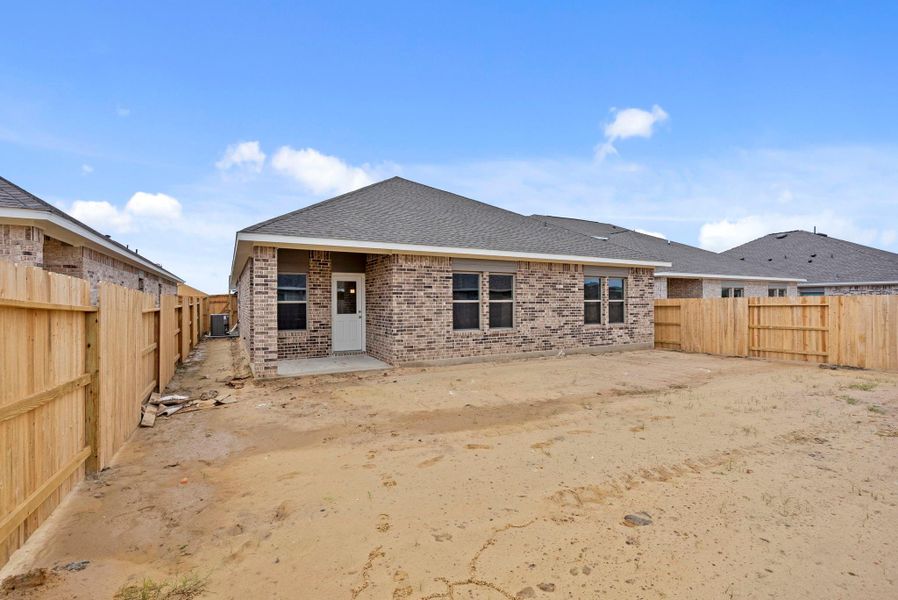 Exterior details and patio area of a home in Windrose Green 50', Angleton (Image 4).