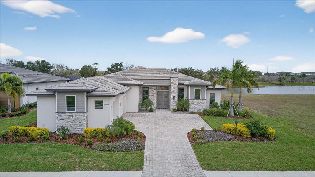 Front exterior of a new home in , Bradenton, FL, highlighting curb appeal (Image 26).