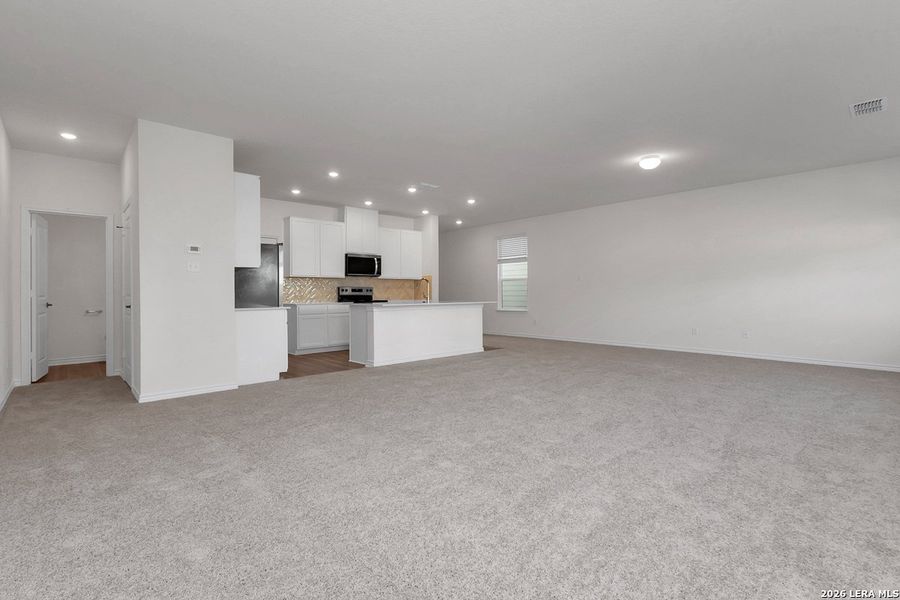 Spacious, unfurnished interior of a new home in Preserve at Culebra - Heritage Collection, San Antonio (Image 11).