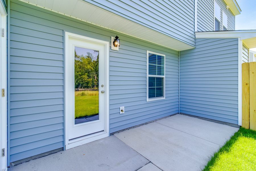 Exterior details and patio area of a home in Padgett Commons, Hopkins (Image 3).