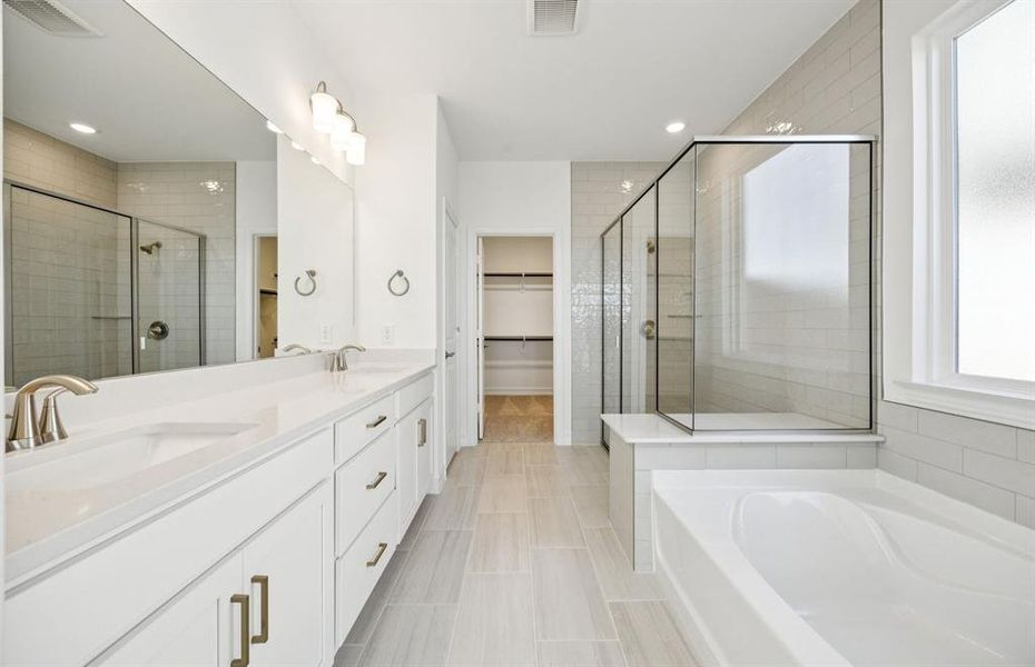 Luxurious owner's bath complete with double sinks and a generous shower Luxurious owner's bath complete with double sinks and a generous shower
