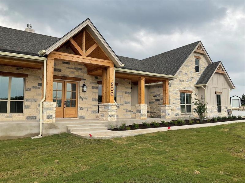 Front porch on this custom home is 47 ft wide