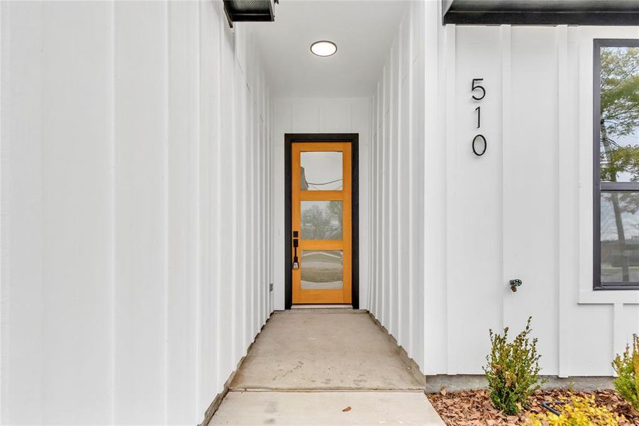 Entrance to property featuring board and batten siding