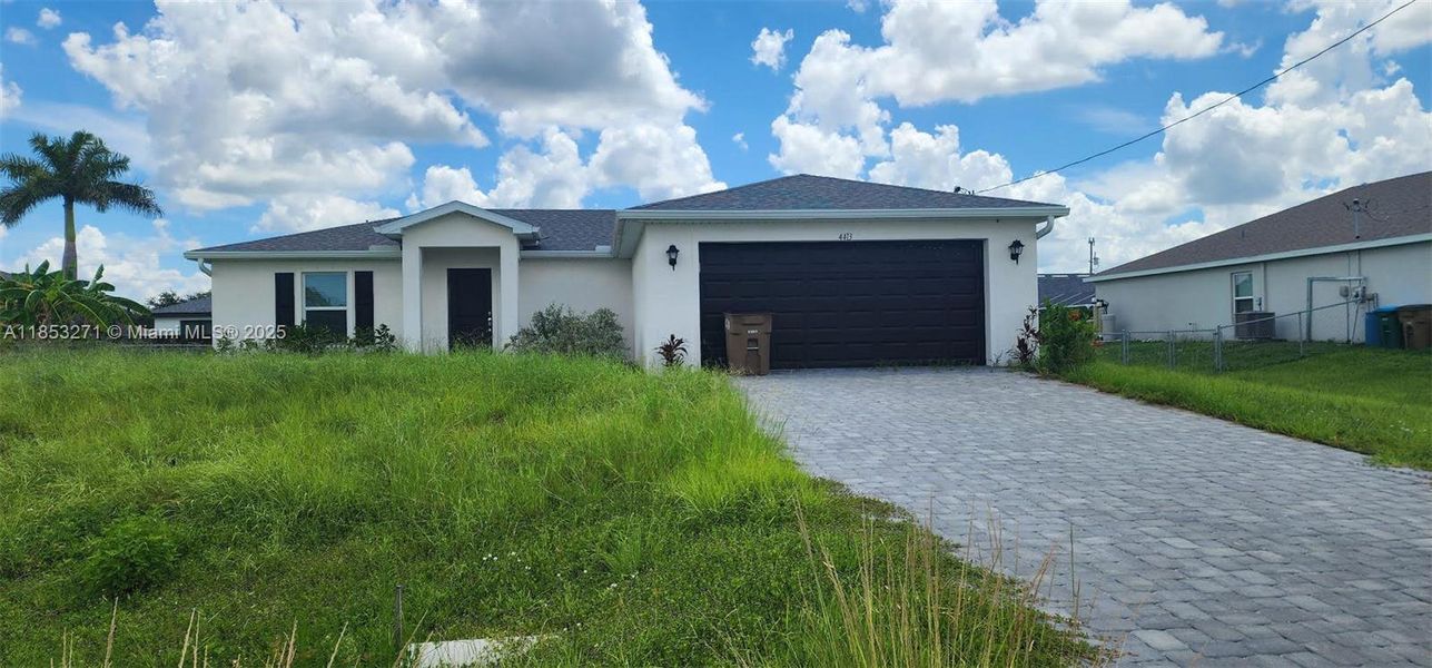 Front exterior of a new home in , Cape Coral, FL, highlighting curb appeal (Image 1).