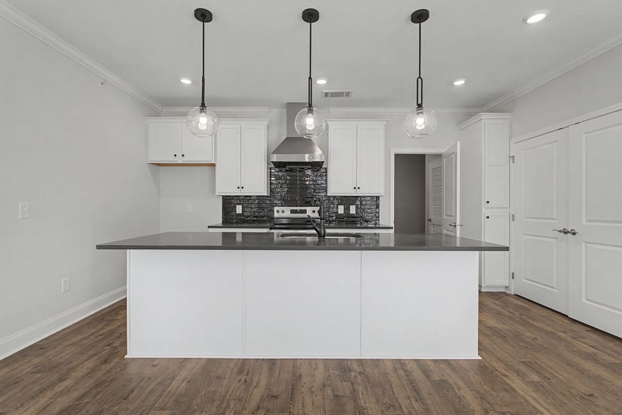 Carothers Farms Town Center Homes (Condos) Kitchen with Island and Accent Lighting