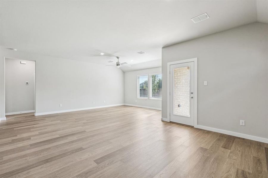 Living and Dining Room in the Heisman home plan by Trophy Signature Homes – REPRESENTATIVE PHOTO Living and Dining Room in the Heisman home plan by Trophy Signature Homes – REPRESENTATIVE PHOTO