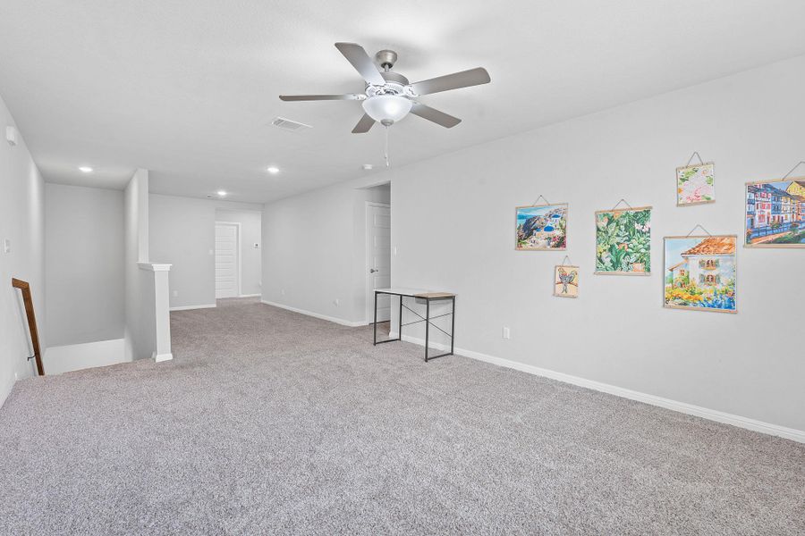 Carpeted spare room featuring baseboards, visible vents, recessed lighting, and ceiling fan Carpeted spare room featuring baseboards, visible vents, recessed lighting, and ceiling fan