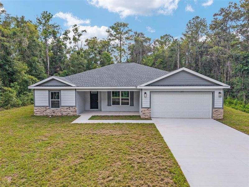 Front exterior of a new home in , Dunnellon, FL, highlighting curb appeal (Image 20).