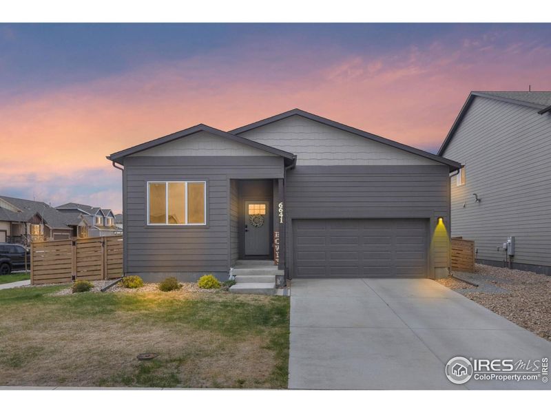 Front exterior of a new home in , Greeley, CO, highlighting curb appeal (Image 20).