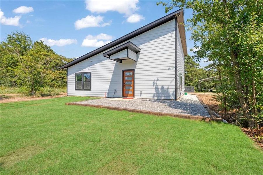 Front exterior of a new home in , Gordonville, TX, highlighting curb appeal (Image 17). Front exterior of a new home in , Gordonville, TX, highlighting curb appeal (Image 17).