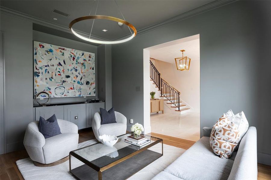 Living room with built-ins and walk-in closet