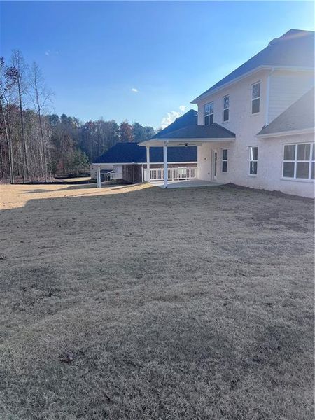 Exterior details and patio area of a home in Mirror Lake at South Harbour, Villa Rica (Image 20).