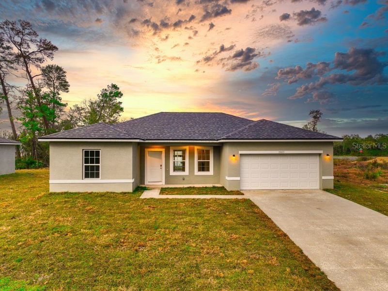 Front exterior of a new home in , Dunnellon, FL, highlighting curb appeal (Image 1).