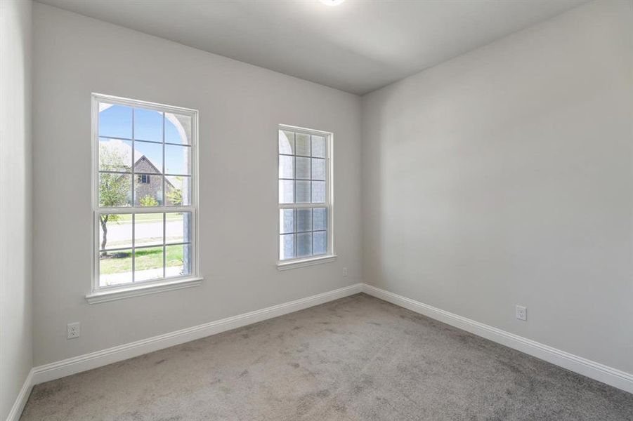 Unfurnished room with carpet flooring