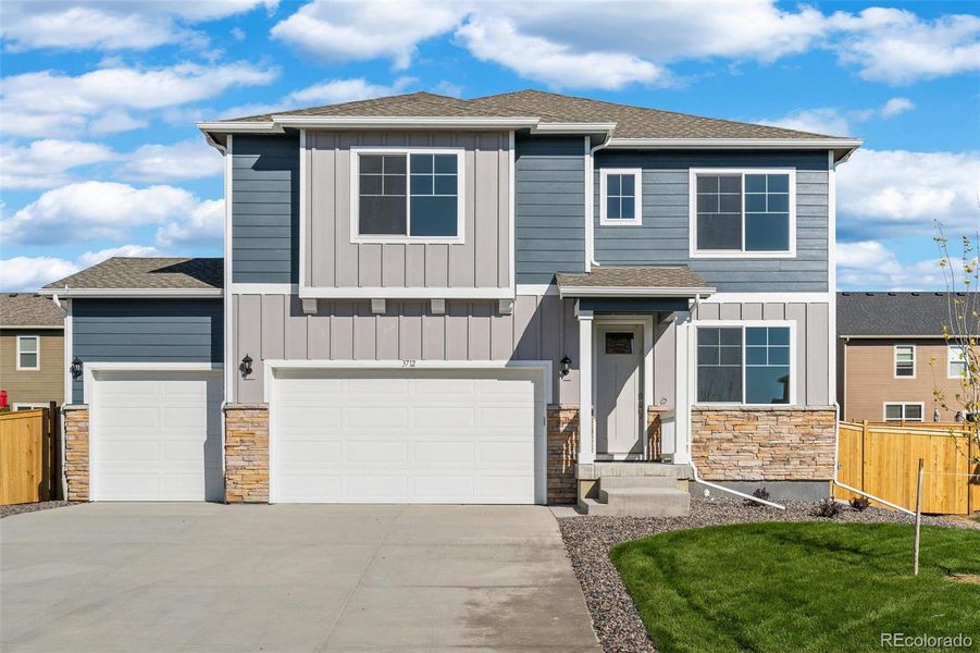 Front exterior of a new home in Trails at Crowfoot, Parker, CO, highlighting curb appeal (Image 2).