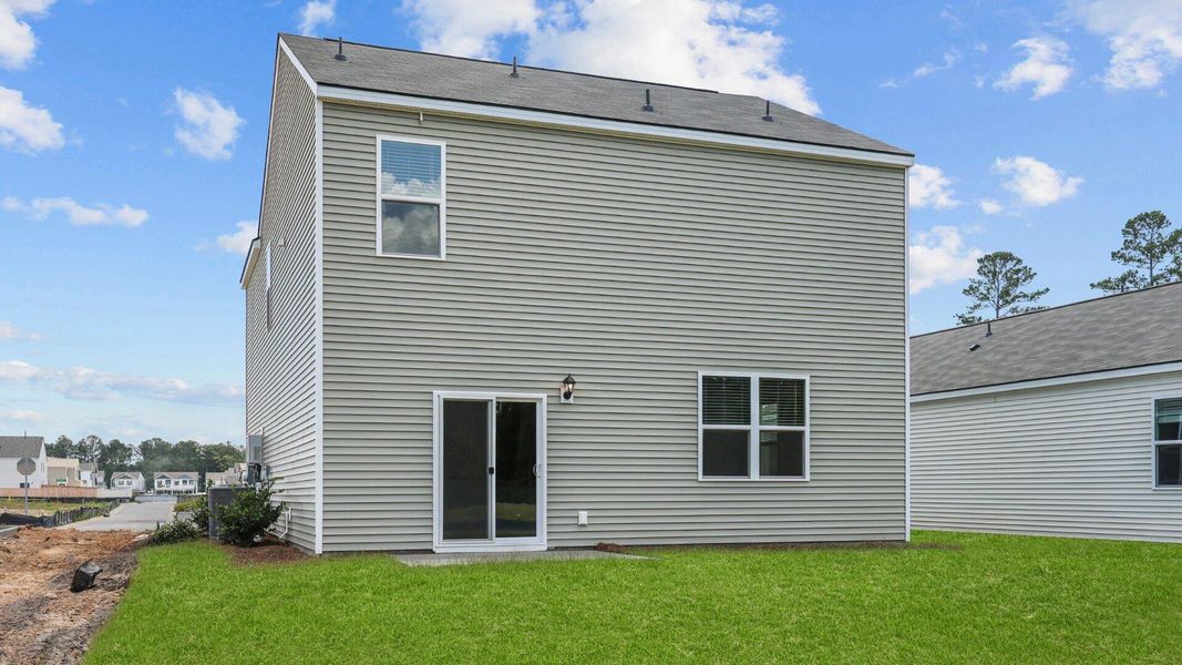 Exterior details and patio area of a home in Pine Hills at Cane Bay, Summerville (Image 2).