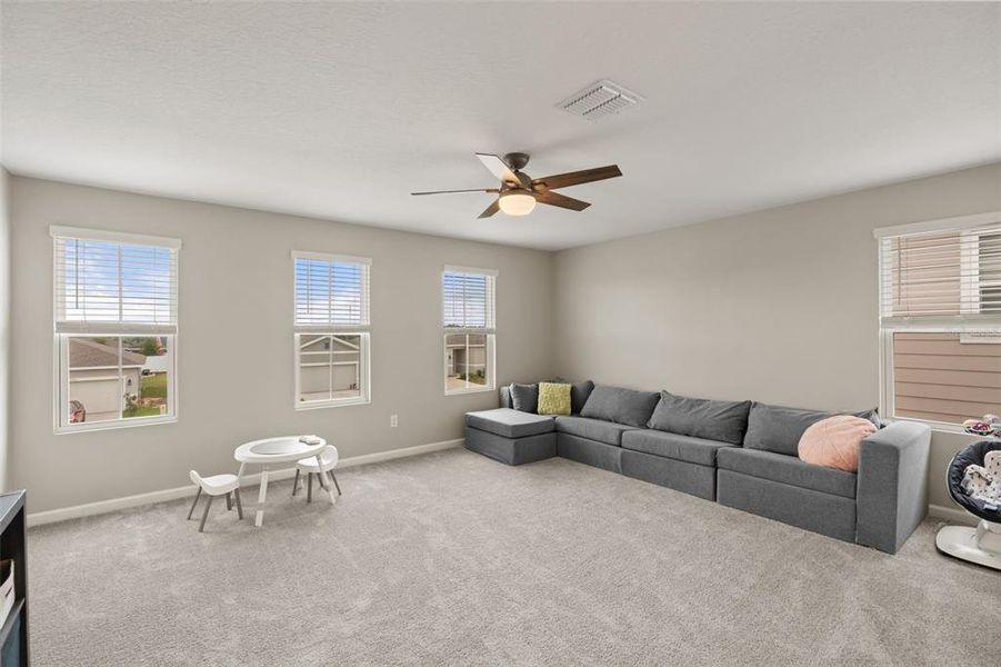 Furnished interior view inside a new home in Seasons at The Grove, Mascotte (Image 13).