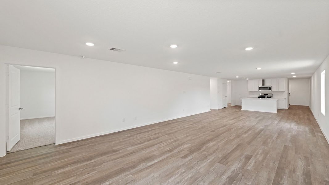 Representative unfurnished interior of a home built from the Estero by D.R. Horton in Lake Conroe Cove, Willis (Image 12). Representative unfurnished interior of a home built from the Estero by D.R. Horton in Lake Conroe Cove, Willis (Image 12).