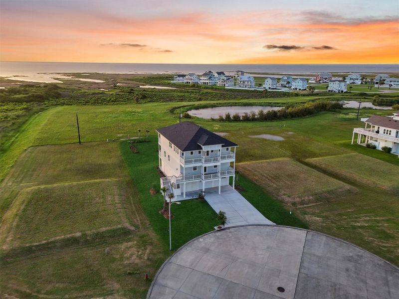 Twilight showcases this coastal masterpiece glowing against the sunset—true Galveston elegance Twilight showcases this coastal masterpiece glowing against the sunset—true Galveston elegance