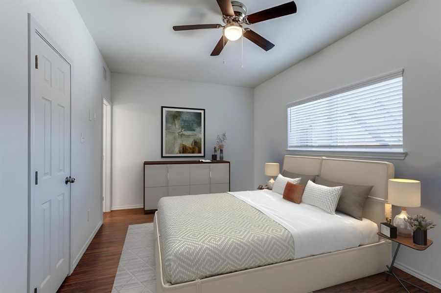 Primary bedroom with ceiling fan, ensuite bath