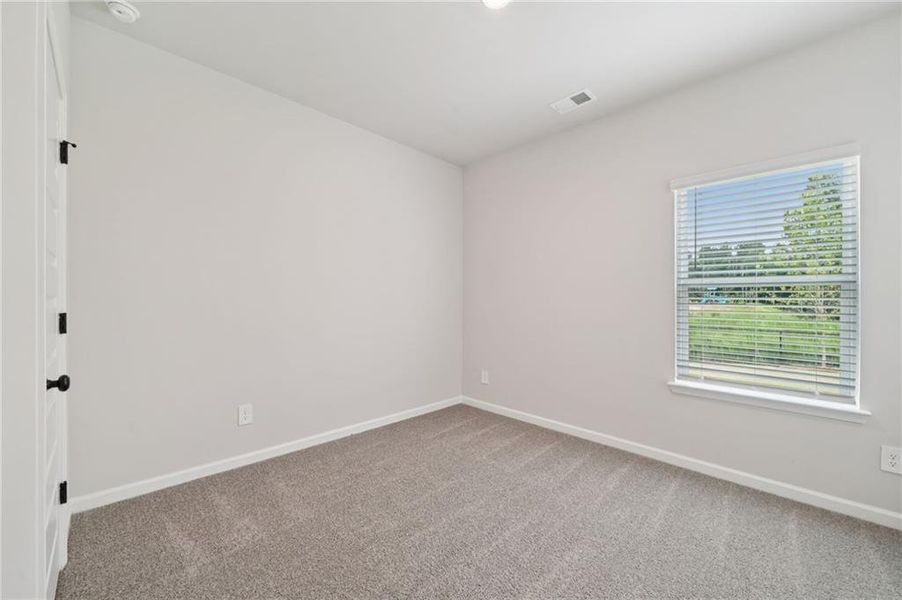 Spacious, unfurnished interior of a new home in Vines at Mill Creek - Estate Series, Braselton (Image 16).