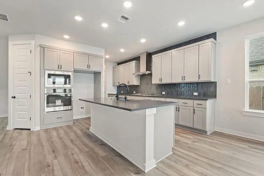 Furnished interior view inside a new home in Flora, Hutto (Image 8).