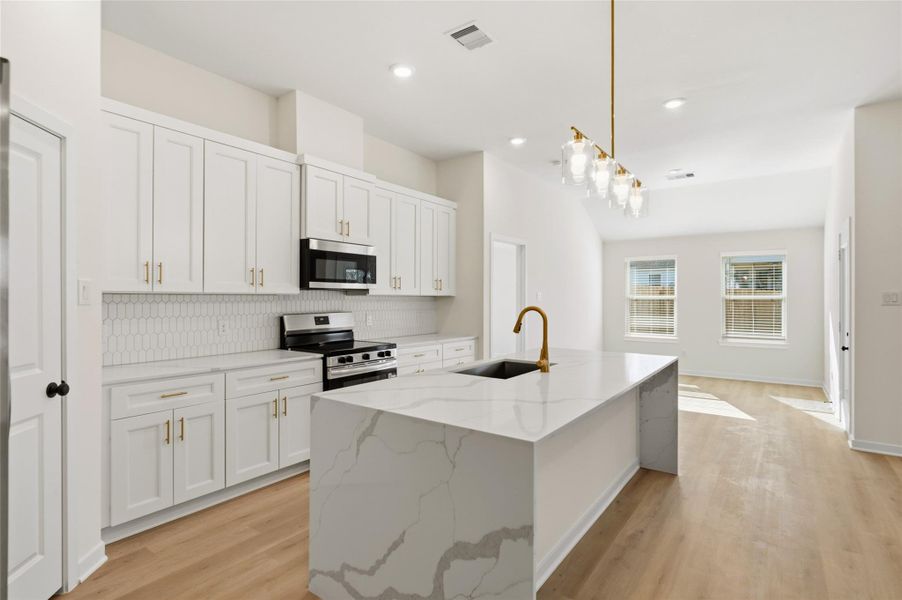 The focal point of this chef's kitchen is the waterfall island and luxury appliances.