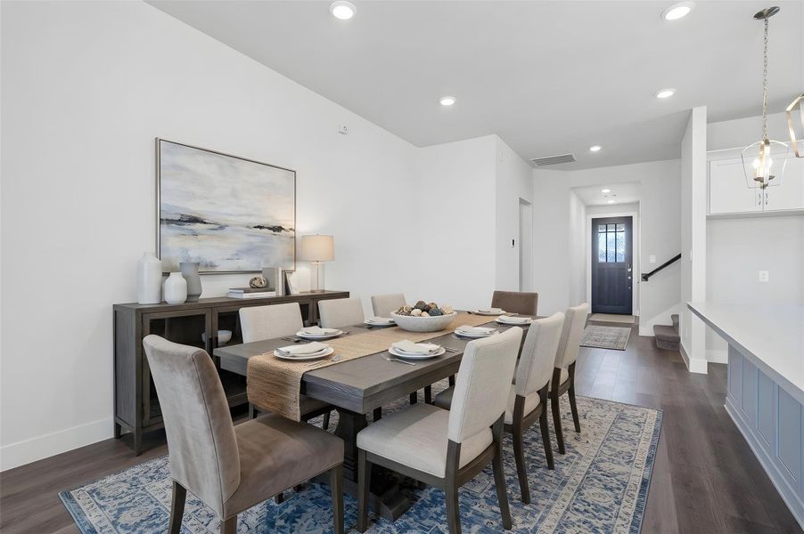 This dining area is a natural extension of the kitchen and living room, allowing for seamless conversation and connection with guests or family members, even when preparing a meal. *Virtually Staged This dining area is a natural extension of the kitchen and living room, allowing for seamless conversation and connection with guests or family members, even when preparing a meal. *Virtually Staged