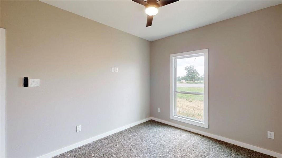 Front right bedroom with remote ceiling fan controls and wall mount flat screen power & data outlets